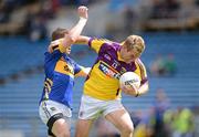 14 July 2012; PJ Banville, Wexford, in action against Robbie Kiely, Tipperary. GAA Football All-Ireland Senior Championship Qualifier, Round 2, Tipperary v Wexford, Semple Stadium, Thurles, Co. Tipperary. Picture credit: Stephen McCarthy / SPORTSFILE