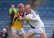 14 July 2012; Tipperary goalkeeper Paul Fitzgerald in action against PJ Banville, Wexford. GAA Football All-Ireland Senior Championship Qualifier, Round 2, Tipperary v Wexford, Semple Stadium, Thurles, Co. Tipperary. Picture credit: Stephen McCarthy / SPORTSFILE