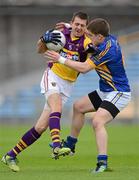 14 July 2012; Adrian Flynn, Wexford, in action against Robbie Kiely, Tipperary. GAA Football All-Ireland Senior Championship Qualifier, Round 2, Tipperary v Wexford, Semple Stadium, Thurles, Co. Tipperary. Picture credit: Stephen McCarthy / SPORTSFILE
