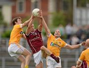 14 July 2012; Joe Bergin, Galway, in action against James Loughrey and Conal Kelly, right, Antrim. GAA Football All-Ireland Senior Championship Qualifier, Round 2, Antrim v Galway, Casement Park, Belfast, Co. Antrim. Picture credit: Oliver McVeigh / SPORTSFILE