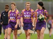 14 July 2012; Wexford's Kate Kelly, left, Ursula Jacob, centre, and Noleen Lambert show their disappointment after the game. All-Ireland Senior Camogie Championship Round Four, in association with RTÉ Sport, Galway v Wexford, Kenny Park, Athenry, Co. Galway. Picture credit: Pat Murphy / SPORTSFILE