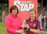 14 July 2012; Martina Conroy, Galway, is presented with the player of the match award by Marie O'Brien, Chairwoman of the Connacht Council. All-Ireland Senior Camogie Championship Round Four, in association with RTÉ Sport, Galway v Wexford, Kenny Park, Athenry, Co. Galway. Picture credit: Pat Murphy / SPORTSFILE