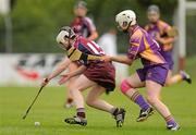 14 July 2012; Tara Ruttledge, Galway, in action against Karen Atkinson, Wexford. All-Ireland Senior Camogie Championship Round Four, in association with RTÉ Sport, Galway v Wexford, Kenny Park, Athenry, Co. Galway. Picture credit: Pat Murphy / SPORTSFILE