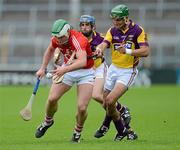 14 July 2012; Niall McCarthy, Cork, in action against Keith Rossiter and Garrett Sinnott, right, Wexford. GAA Hurling All-Ireland Senior Championship, Phase 3, Wexford v Cork, Semple Stadium, Thurles, Co. Tipperary. Picture credit: Matt Browne / SPORTSFILE