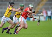 14 July 2012; Niall McCarthy, Cork, in action against Keith Rossiter and Darren Stamp, Wexford. GAA Hurling All-Ireland Senior Championship, Phase 3, Wexford v Cork, Semple Stadium, Thurles, Co. Tipperary. Picture credit: Matt Browne / SPORTSFILE