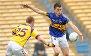 14 July 2012; Michael Quinlivan, Tipperary, in action against Aindreas Doyle, Wexford. GAA Football All-Ireland Senior Championship Qualifier, Round 2, Tipperary v Wexford, Semple Stadium, Thurles, Co. Tipperary. Picture credit: Matt Browne / SPORTSFILE