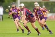 14 July 2012; Regina Glynn, Galway, in action against Michelle O'Leary and Kate Kelly, right, Wexford. All-Ireland Senior Camogie Championship Round Four, in association with RTÉ Sport, Galway v Wexford, Kenny Park, Athenry, Co. Galway. Picture credit: Pat Murphy / SPORTSFILE