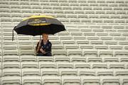 15 July 2012; Gearoid Fennessy, from Clonmel, takes cover in the 'uncovered stand'. Munster GAA Hurling Senior Championship Final, Waterford v Tipperary, Pairc Ui Chaoimh, Cork. Picture credit: Ray McManus / SPORTSFILE