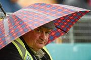 15 July 2012; Bill Harte, from Carbery Rangers, Rosscarbery, West Cork, shelters from the rain before the game. Munster GAA Hurling Senior Championship Final, Waterford v Tipperary, Pairc Ui Chaoimh, Cork. Picture credit: Ray McManus / SPORTSFILE