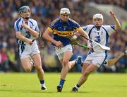 15 July 2012; Patrick Maher, Tipperary, in action against Michael Walsh, left, and Stephen Molumphy, Waterford. Munster GAA Hurling Senior Championship Final, Waterford v Tipperary, Pairc Ui Chaoimh, Cork. Picture credit: Stephen McCarthy / SPORTSFILE