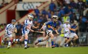 15 July 2012; Mark Downey, Ballytarsna NS, Tipperary, in action against Conor Quinn, S.N. na Rinne, Waterford, during the Primary Go-games. Munster GAA Hurling Senior Championship Final, Waterford v Tipperary, Pairc Ui Chaoimh, Cork. Picture credit: Stephen McCarthy / SPORTSFILE