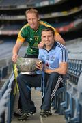 16 July 2012; Dublin footballer Alan Brogan, right, with former Meath footballer, and current Meath selector Graham Geraghty, hold the Delaney Cup, after a press conference ahead of their side's Leinster GAA Football Senior Championship Final on Sunday. Croke Park, Dublin. Picture credit: Barry Cregg / SPORTSFILE