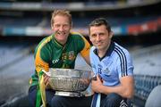 16 July 2012; Dublin footballer Alan Brogan, right, with former Meath footballer, and current Meath selector Graham Geraghty, hold the Delaney Cup, after a press conference ahead of their side's Leinster GAA Football Senior Championship Final on Sunday. Croke Park, Dublin. Picture credit: Barry Cregg / SPORTSFILE