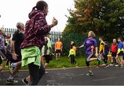 30 September 2017; Former Cork GAA footballer Valerie Mulcahy going through a warm up with participants ahead of the Ballincollig parkrun where Vhi hosted a special event to celebrate their partnership with parkrun Ireland. Former Cork GAA footballer Valerie Mulcahy was on hand to lead the warm up for parkrun participants before completing the 5km course alongside newcomers and seasoned parkrunners alike. Vhi provided walkers, joggers, runners and volunteers at Ballincollig parkrun with a variety of refreshments in the Vhi Relaxation Area at the finish line. A qualified physiotherapist Will Cuddihy was also available to guide participants through a post event stretching routine to ease those aching muscles. Parkruns take place over a 5km course weekly, are free to enter and are open to all ages and abilities, providing a fun and safe environment to enjoy exercise. To register for a parkrun near you visit www.parkrun.ie. New registrants should select their chosen event as their home location. You will then receive a personal barcode which acts as your free entry to any parkrun event worldwide. The Regional Park, Ballincollig, Co Cork. Photo by Eóin Noonan/Sportsfile