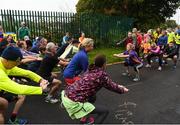 30 September 2017; Former Cork GAA footballer Valerie Mulcahy going through a warm up with participants ahead of the Ballincollig parkrun where Vhi hosted a special event to celebrate their partnership with parkrun Ireland. Former Cork GAA footballer Valerie Mulcahy was on hand to lead the warm up for parkrun participants before completing the 5km course alongside newcomers and seasoned parkrunners alike. Vhi provided walkers, joggers, runners and volunteers at Ballincollig parkrun with a variety of refreshments in the Vhi Relaxation Area at the finish line. A qualified physiotherapist Will Cuddihy was also available to guide participants through a post event stretching routine to ease those aching muscles. Parkruns take place over a 5km course weekly, are free to enter and are open to all ages and abilities, providing a fun and safe environment to enjoy exercise. To register for a parkrun near you visit www.parkrun.ie. New registrants should select their chosen event as their home location. You will then receive a personal barcode which acts as your free entry to any parkrun event worldwide. The Regional Park, Ballincollig, Co Cork. Photo by Eóin Noonan/Sportsfile