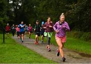 30 September 2017; Participants during the Ballincollig parkrun where Vhi hosted a special event to celebrate their partnership with parkrun Ireland. Former Cork GAA footballer Valerie Mulcahy was on hand to lead the warm up for parkrun participants before completing the 5km course alongside newcomers and seasoned parkrunners alike. Vhi provided walkers, joggers, runners and volunteers at Ballincollig parkrun with a variety of refreshments in the Vhi Relaxation Area at the finish line. A qualified physiotherapist Will Cuddihy was also available to guide participants through a post event stretching routine to ease those aching muscles. Parkruns take place over a 5km course weekly, are free to enter and are open to all ages and abilities, providing a fun and safe environment to enjoy exercise. To register for a parkrun near you visit www.parkrun.ie. New registrants should select their chosen event as their home location. You will then receive a personal barcode which acts as your free entry to any parkrun event worldwide. The Regional Park, Ballincollig, Co Cork. Photo by Eóin Noonan/Sportsfile