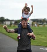 30 September 2017; Billy Lennon, age 3, and his father Paul Lennon, from Coolock, Co Dublin, celebrate as they finish the run. parkrun Ireland in partnership with Vhi, added their 79th event on Saturday, September 30th, with the introduction of the Darndale parkrun. parkruns take place over a 5km course weekly, are free to enter and are open to all ages and abilities, providing a fun and safe environment to enjoy exercise. To register for a parkrun near you visit www.parkrun.ie. New registrants should select their chosen event as their home location. You will then receive a personal barcode which acts as your free entry to any parkrun event worldwide. The Football Pavilion, Darndale, Dublin. Photo by Cody Glenn/Sportsfile