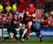 30 September 2017; Robin Copeland of Munster is tackled by Jarrod Evans, left, and Matthew Rees of Cardiff Blues during the Guinness PRO14 Round 5 match between Munster and Cardiff Blues at Thomond Park in Limerick. Photo by Brendan Moran/Sportsfile