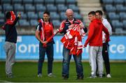 30 September 2017; Cuala kit man Aidan McMahon hands out the jerseys to players ahead of the Dublin County Senior Football Championship Quarter-Final match between Cuala and St Jude's at Parnell Park in Dublin. Photo by David Fitzgerald/Sportsfile