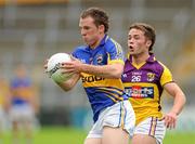 14 July 2012; Peter Acheson, Tipperary, in action against Conor Carty, Wexford. GAA Football All-Ireland Senior Championship Qualifier, Round 2, Tipperary v Wexford, Semple Stadium, Thurles, Co. Tipperary. Picture credit: Matt Browne / SPORTSFILE