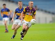 14 July 2012; Colm Morris, Wexford, in action against Alan Campbell, Tipperary. GAA Football All-Ireland Senior Championship Qualifier, Round 2, Tipperary v Wexford, Semple Stadium, Thurles, Co. Tipperary. Picture credit: Matt Browne / SPORTSFILE