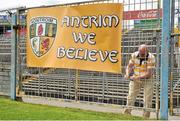 21 July 2012; Pat O'Hagan, from Belfast, Co. Antrim, ties up a banner showing support for his team. GAA Football All-Ireland Senior Championship Qualifier, Round 3, Tipperary v Antrim, Semple Stadium, Thurles, Co. Tipperary. Picture credit: Barry Cregg / SPORTSFILE