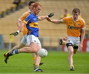 21 July 2012; George Hannigan, Tipperary, in action against Justin Crozier, Antrim. GAA Football All-Ireland Senior Championship Qualifier, Round 3, Tipperary v Antrim, Semple Stadium, Thurles, Co. Tipperary. Picture credit: Barry Cregg / SPORTSFILE