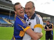 21 July 2012; Alan Moloney, left, Tipperary, and manager Peter Creedon celebrate victory after the game. GAA Football All-Ireland Senior Championship Qualifier, Round 3, Tipperary v Antrim, Semple Stadium, Thurles, Co. Tipperary. Picture credit: Barry Cregg / SPORTSFILE
