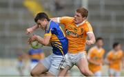 21 July 2012; Michael Quinlivan, Tipperary, in action against Martin Johnson, Antrim. GAA Football All-Ireland Senior Championship Qualifier, Round 3, Tipperary v Antrim, Semple Stadium, Thurles, Co. Tipperary. Picture credit: Barry Cregg / SPORTSFILE