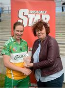21 July 2012; Siobhán Flannery, Offaly, receives her player of the game award from Leinster camogie chairperson Catherine Neary. All-Ireland Senior Camogie Championship Play-Off, Offaly v Kilkenny, St. Brendan's Park, Birr, Co. Offaly. Picture credit: Daire Brennan / SPORTSFILE