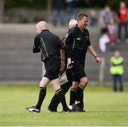21 July 2012; Referee Rory Hickey, right, is substituted by stand by referee Martin Higgins during the game. GAA Football All-Ireland Senior Championship Qualifier, Round 3, Leitrim v Laois, Sean McDermott Park, Carrick-on-Shannon, Co. Leitrim. Picture credit: David Maher / SPORTSFILE
