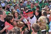 21 July 2012; Tyrone manager Mickey Harte signs autographs for supporters on the pitch after the game. GAA Football All-Ireland Senior Championship Qualifier, Round 3, Kerry v Tyrone, Fitzgerald Stadium, Killarney, Co. Kerry. Picture credit: Diarmuid Greene / SPORTSFILE