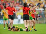 22 July 2012; A row breaks out between Paddy McGrath, Donegal, and Mark Poland, Down, during the game. Ulster GAA Football Senior Championship Final, Donegal v Down, St. Tiernach's Park, Clones, Co. Monaghan. Photo by Sportsfile