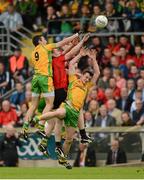 22 July 2012; Rory Kavanagh, left, and Leo McLoone, Donegal, in action against Kalum King, left, and Liam Doyle, Down. Ulster GAA Football Senior Championship Final, Donegal v Down, St. Tiernach's Park, Clones, Co. Monaghan. Photo by Sportsfile
