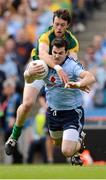 22 July 2012; Michael Darragh MacAuley, Dublin, is tackled by Meath's Brian Meade early in the game. Leinster GAA Football Senior Championship Final, Dublin v Meath, Croke Park, Dublin. Picture credit: Ray McManus / SPORTSFILE