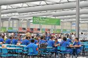 24 July 2012; Athletes eat in the Dining Hall of the Athlete's Village in the Olympic Park during a tour of the venue. London 2012 Olympic Games, Athletes Village Residential Tour, Olympic Park, Stratford, London, England. Picture credit: Brendan Moran / SPORTSFILE