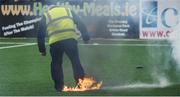1 October 2017; A flare is dealt with on the pitch prior to the Irish Daily Mail FAI Cup semi final match between Dundalk and Shamrock Rovers at Oriel Park in Dundalk. Photo by Stephen McCarthy/Sportsfile