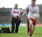 21 July 2012; Tyrone manager Mickey Harte watches his team warm-up before the game. GAA Football All-Ireland Senior Championship Qualifier, Round 3, Kerry v Tyrone, Fitzgerald Stadium, Killarney, Co. Kerry. Picture Credit: Diarmuid Greene / SPORTSFILE