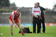 21 July 2012; Tyrone manager Mickey Harte watches as Stephen O'Neill warms up before the game. GAA Football All-Ireland Senior Championship Qualifier, Round 3, Kerry v Tyrone, Fitzgerald Stadium, Killarney, Co. Kerry. Picture Credit: Diarmuid Greene / SPORTSFILE