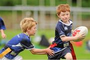 25 July 2012; Conor O'Brien is tackled by Aiden O'Carroll, left, while enjoying the Donnybrook VW Leinster Rugby Summer Camp. Donnybrook Stadium, Donnybrook, Dublin. Picture credit: Pat Murphy / SPORTSFILE