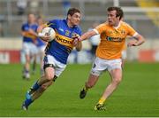 21 July 2012; Philip Austin, Tipperary, in action against James Loughrey, Antrim. GAA Football All-Ireland Senior Championship Qualifier, Round 3, Tipperary v Antrim, Semple Stadium, Thurles, Co. Tipperary. Picture Credit: Barry Cregg / SPORTSFILE
