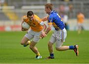 21 July 2012; Conor Murray, Antrim, in action against Richie Ryan, Tipperary. GAA Football All-Ireland Senior Championship Qualifier, Round 3, Tipperary v Antrim, Semple Stadium, Thurles, Co. Tipperary. Picture Credit: Barry Cregg / SPORTSFILE