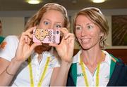 27 July 2012; Irish athlete Aileen Morrison, left, triathlon, and Olive Loughnane, race walking, take a photo with their phone while awaiting the arrival of An Taoiseach Enda Kenny, T.D., at their training base in St. Mary's University College ahead of the London 2012 Olympic Games. Teddington, Middlesex, London, England. Picture credit: Brendan Moran / SPORTSFILE