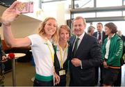 27 July 2012; An Taoiseach Enda Kenny, T.D., poses for a photot with Irish athletes Aileen Morrison, left, triathlon, and Olive Loughnane, race walking, at their training base in St. Mary's University College ahead of the London 2012 Olympic Games. Teddington, Middlesex, London, England. Picture credit: Brendan Moran / SPORTSFILE