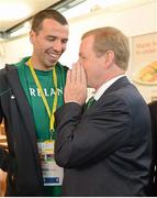 27 July 2012; An Taoiseach Enda Kenny, T.D., speaks to Irish marathon runner Mark Kenneally at their training base in St. Mary's University College ahead of the London 2012 Olympic Games. Teddington, Middlesex, London, England. Picture credit: Brendan Moran / SPORTSFILE