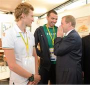 27 July 2012; An Taoiseach Enda Kenny, T.D., speaks to Irish marathon runner Mark Kenneally, in the company of triathlete Gavin Noble, left, at their training base in St. Mary's University College ahead of the London 2012 Olympic Games. Teddington, Middlesex, London, England. Picture credit: Brendan Moran / SPORTSFILE