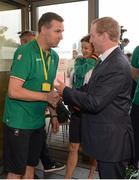 27 July 2012; An Taoiseach Enda Kenny, T.D., greets Irish team physio Ger Hartmann while visiting Irish athletes at their training base in St. Mary's University College ahead of the London 2012 Olympic Games. Teddington, Middlesex, London, England. Picture credit: Brendan Moran / SPORTSFILE