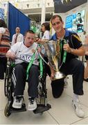 27 July 2012; Leinster Rugby players Ian Madigan, Jamie Hagan and Devin Toner were in The Square, Tallaght, for a meet and greet session to promote the Leinster v Gloucester pre-season friendly at Tallaght Stadium which takes place on Saturday 11th August. Pictured is Devin Toner with Carl Poole, from Springfield, Dublin. The Square, Tallaght, Dublin. Picture credit: Pat Murphy / SPORTSFILE