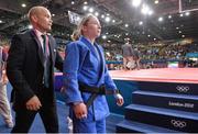 28 July 2012; A dejected Lisa Kearney, Ireland, leaves the mat with her coach Ciaran Ward after defeat in the women -48kg elimination round of 16 to Shugen Wu, China. London 2012 Olympic Games, Judo, North Arena 2, ExCeL Arena, Royal Victoria Dock, London, England. Picture credit: Brendan Moran / SPORTSFILE
