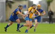 28 July 2012; Katie Cahill, Clare, in action against Jill Horan, left, and Joanne Ryan, right, Tipperary. All-Ireland Senior Camogie Championship, Quarter-Final Qualifier, Clare v Tipperary, O'Moore Park, Portlaoise, Co. Laois. Picture credit: Pat Murphy / SPORTSFILE